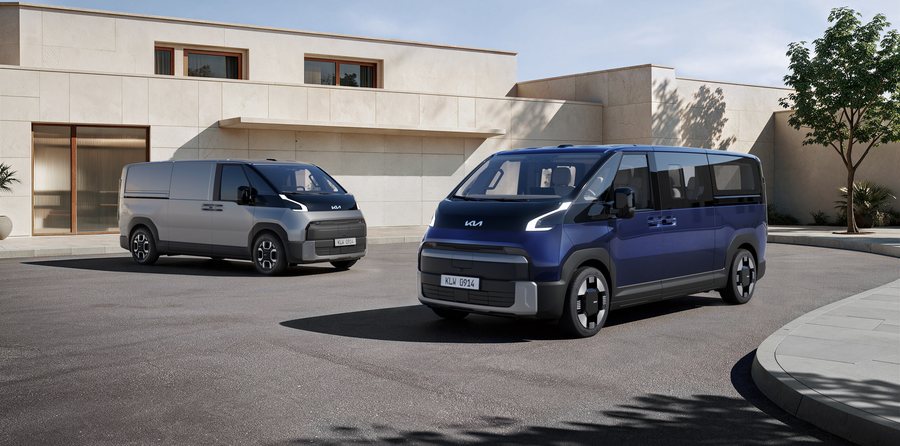 A blue Kia PV7 Passenger and a grey PV7 Cargo parked outside a modern building.